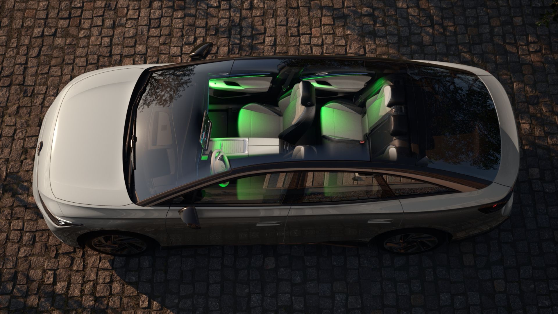 Ansicht der VW ID.7 Ambientebeleuchtung in grün durch das Panoramadach aus der Vogelperspekive