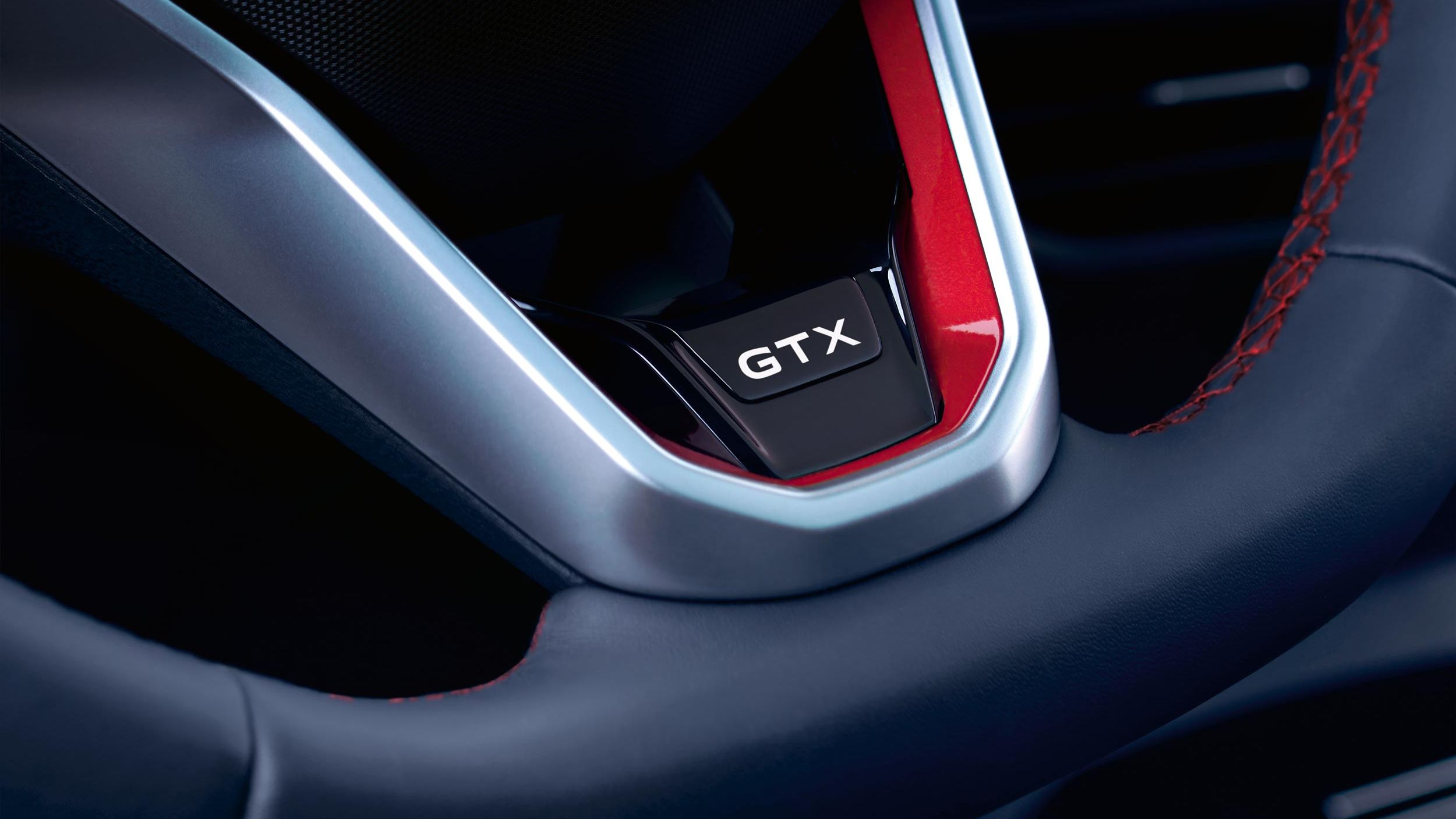 VW ID.4 GTX Innenraum mit Blick aufs Lenkrad mit GTX Schriftzug.