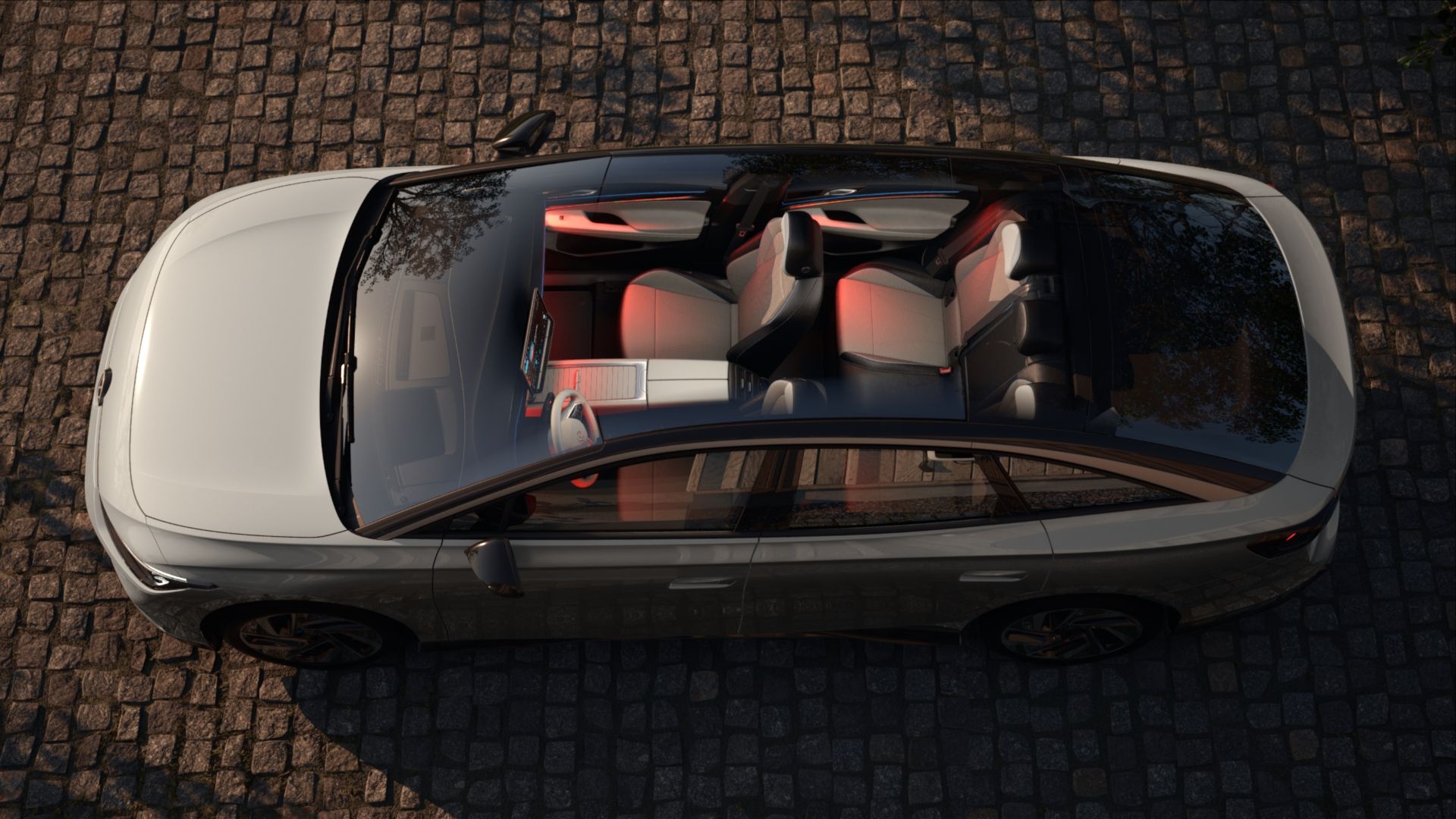 Ansicht der VW ID.7 Ambientebeleuchtung in rot durch das Panoramadach aus der Vogelperspekive
