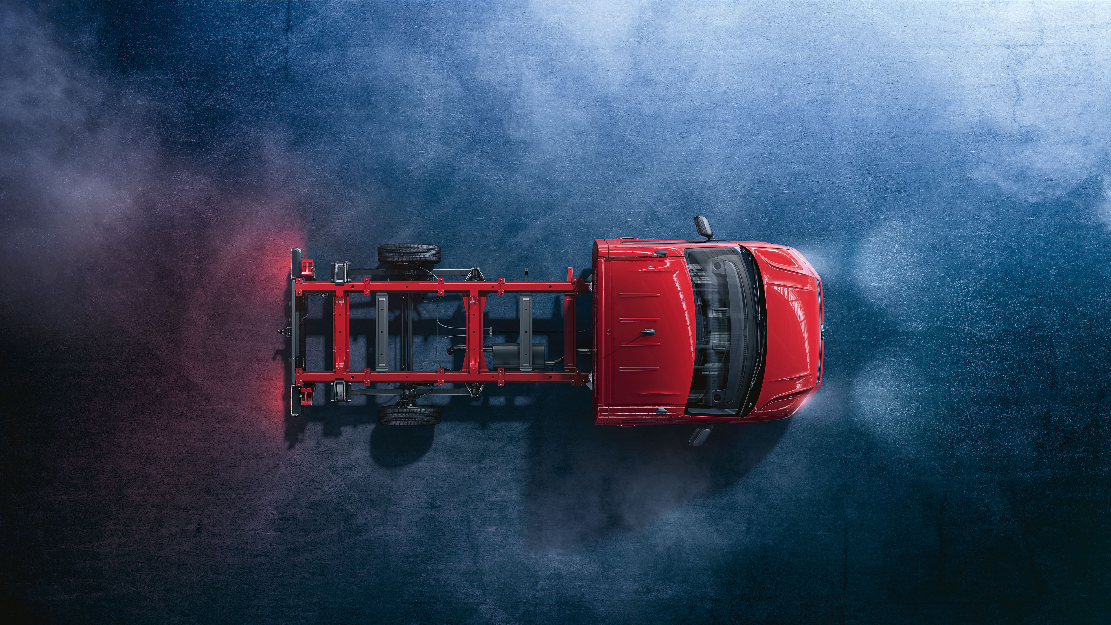 Ein rotes Volkswagen Nutzfahrzeuge Crafter Fahrgestell von oben.